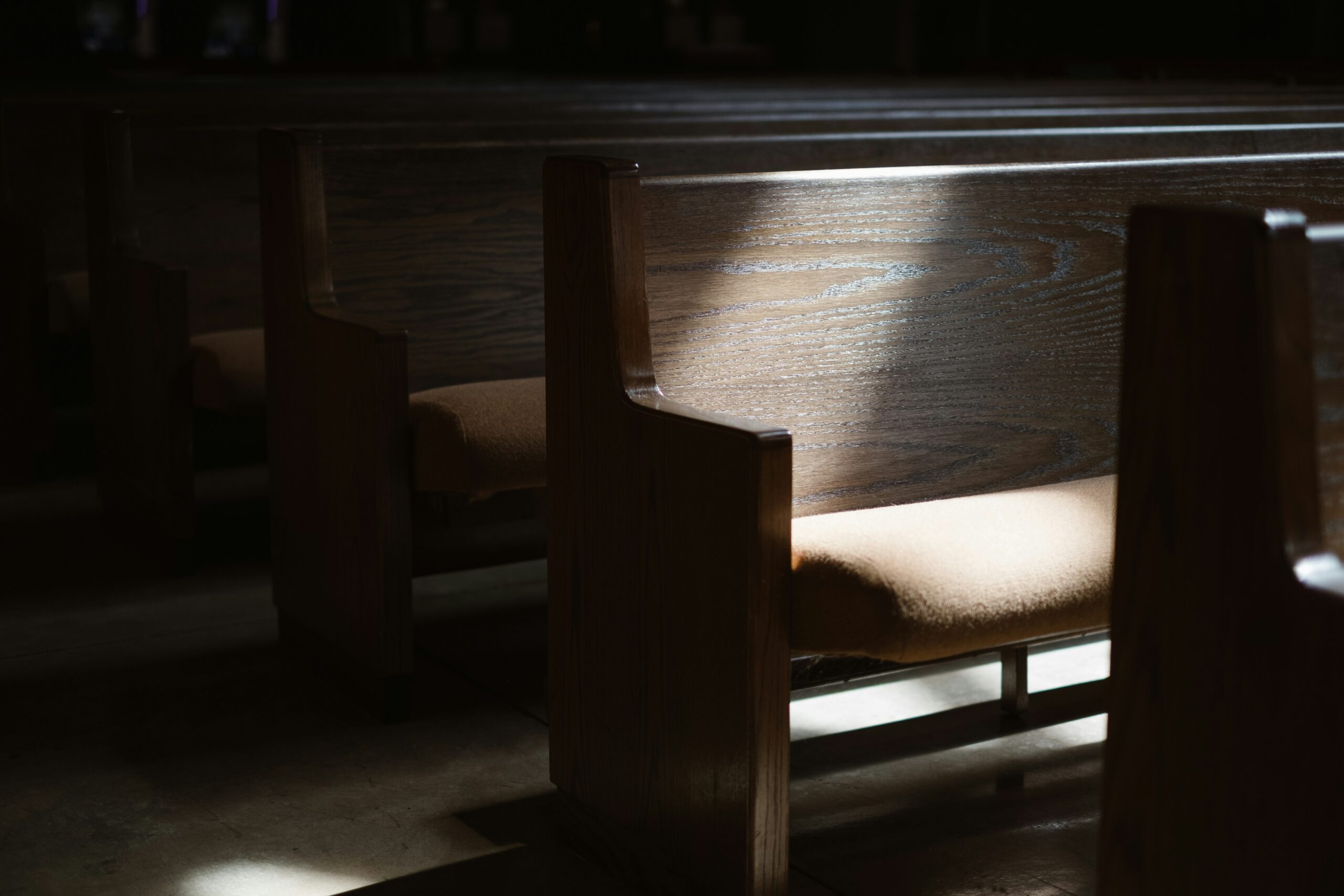Empty and dusty wooden chair in a church