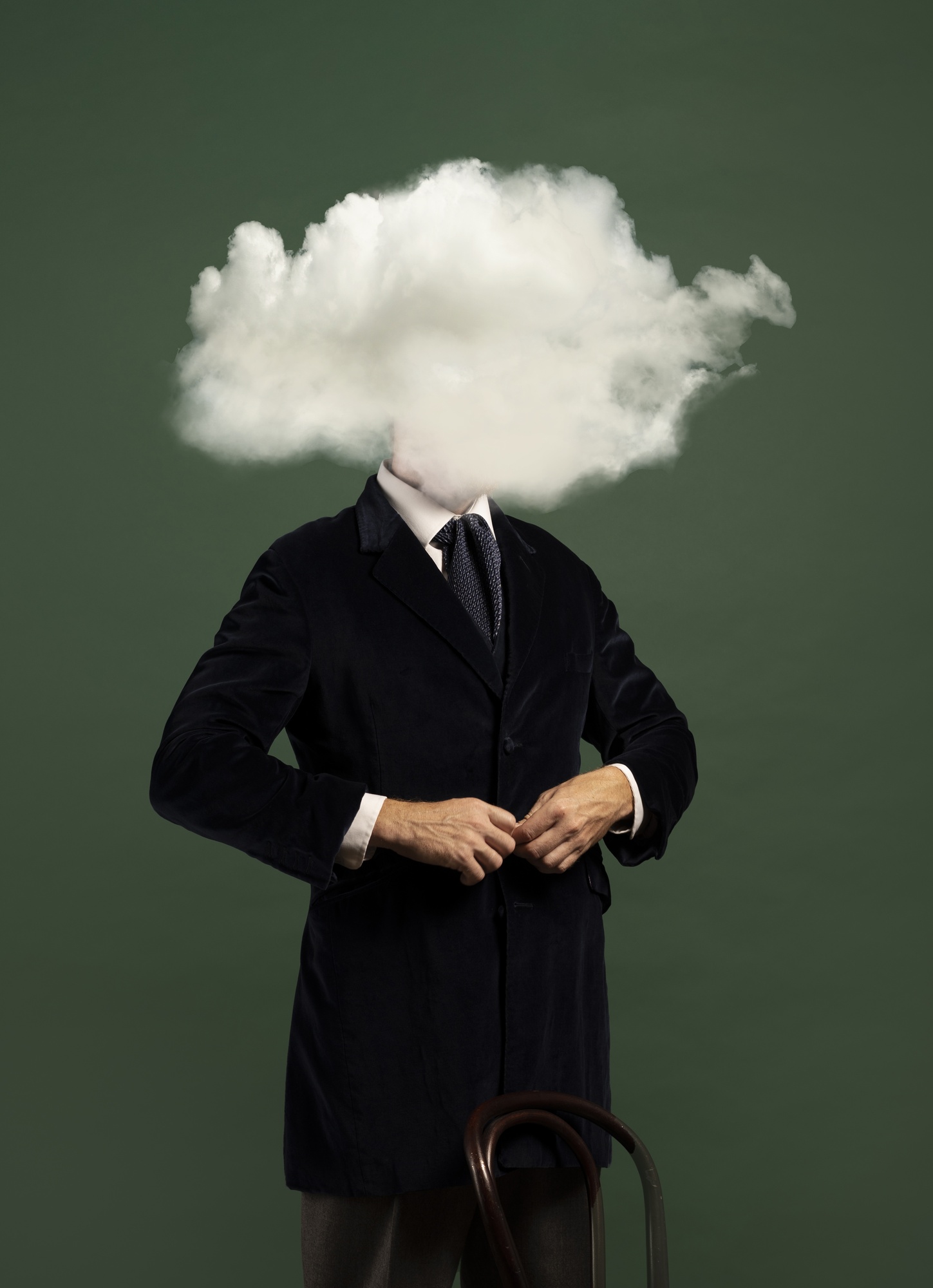 Head covered by a cloud, symbolizing confusion, distraction, or mental fog.